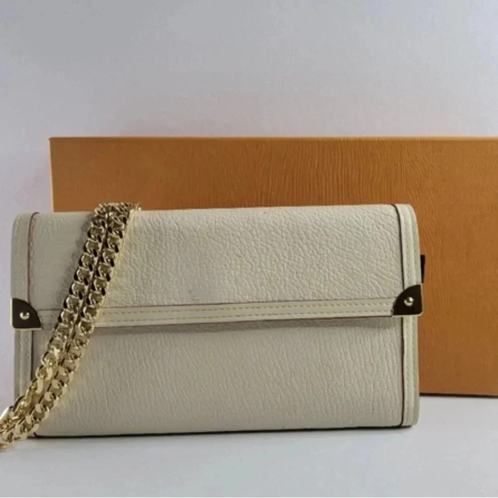 LOUIS VUITTON Leather Suhali International Trifold Long Wallet